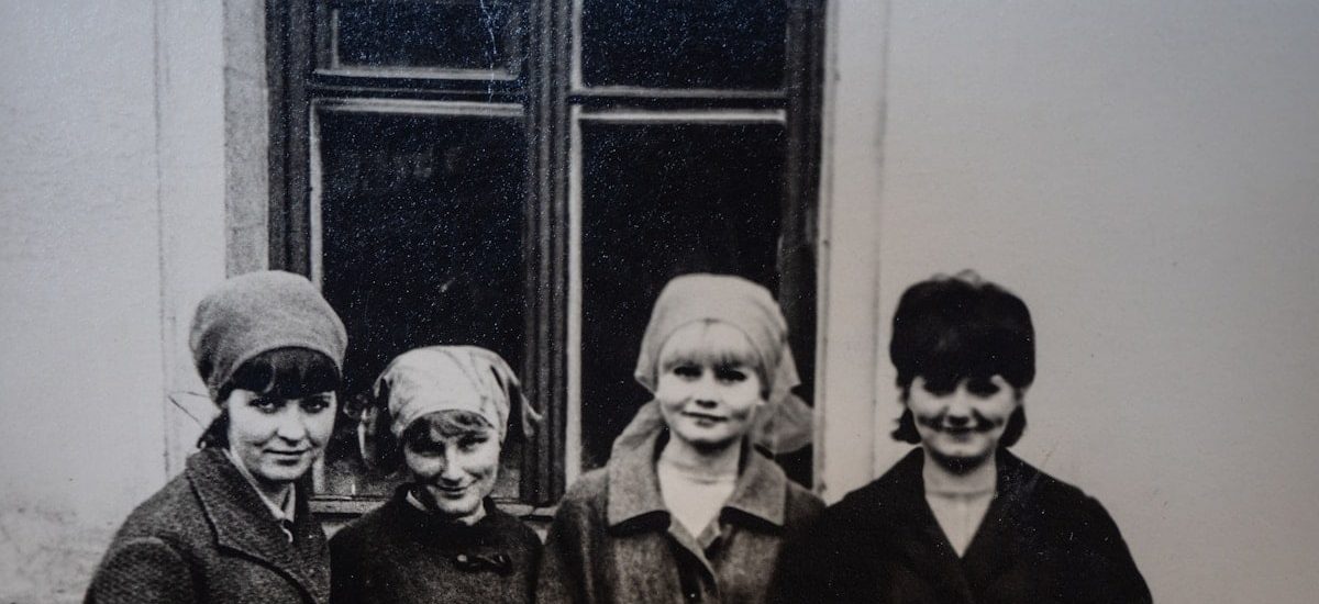 a group of women standing next to each other
