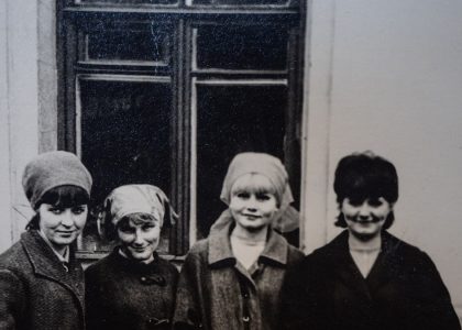 a group of women standing next to each other